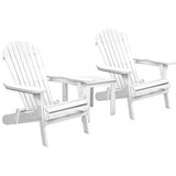 White timber adirondack chairs with side table in a garden