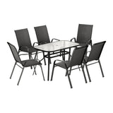Seven piece outdoor dining set with glass table and six black Textilene chairs