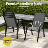 Five piece outdoor dining set with glass table and four grey Textilene chairs