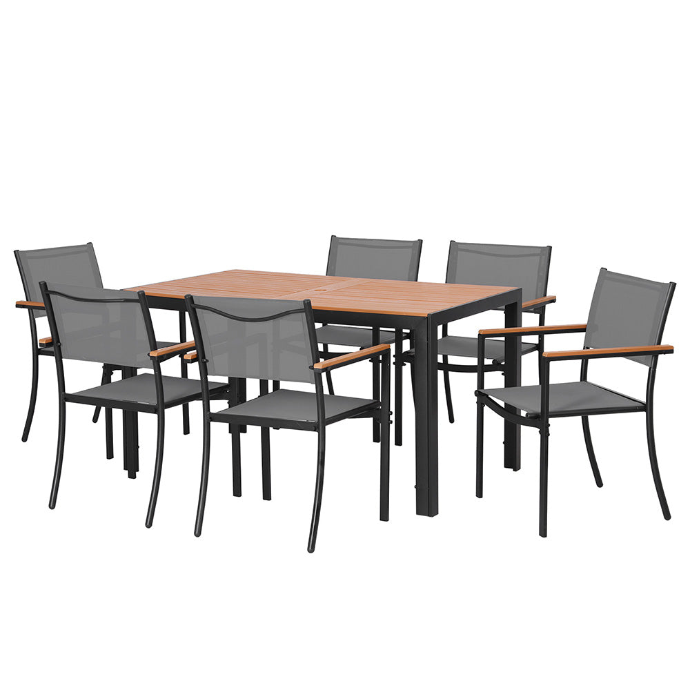 Seven piece outdoor dining set arranged on a patio
