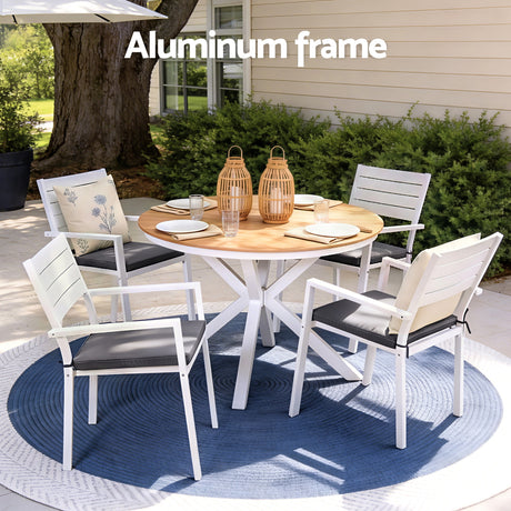 Five piece aluminium patio dining set arranged outdoors