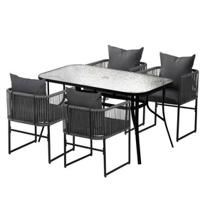 Miami 5 piece black steel outdoor dining set with table and chairs in a garden