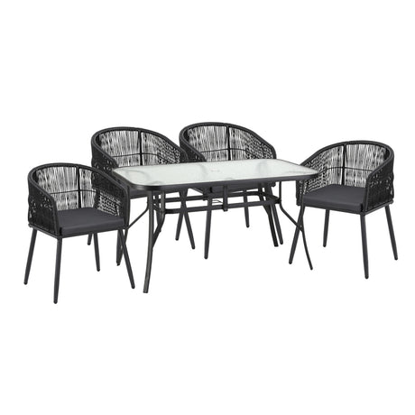 Rattan outdoor dining set arranged on a patio