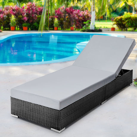 Bundaberg black wicker sun lounge in an outdoor setting