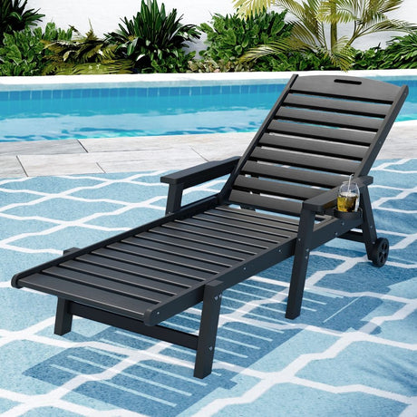 Kiama black HDPE sun lounger with wheels reclining on a patio