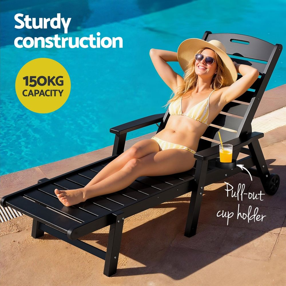 Kiama black HDPE sun lounger with wheels reclining on a patio
