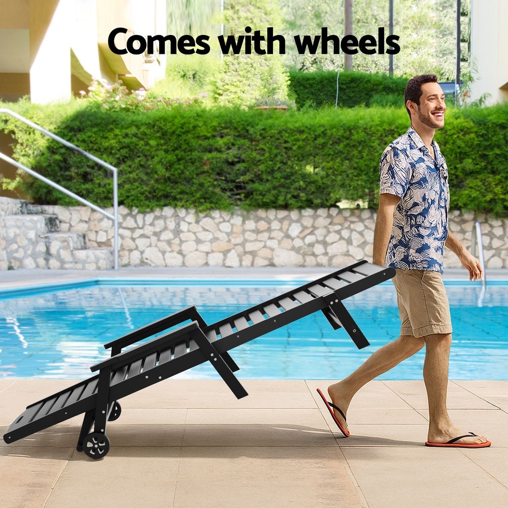 Kiama black HDPE sun lounger with wheels reclining on a patio