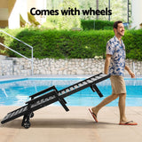 Kiama black HDPE sun lounger with wheels reclining on a patio