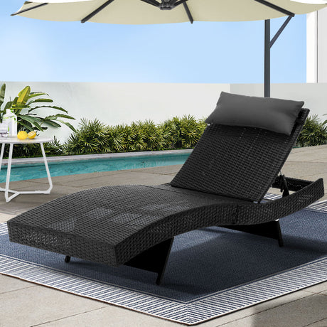 Agnes Water black wicker sun lounge in an outdoor setting
