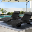 Black rattan wicker reclining sun lounger beside a pool