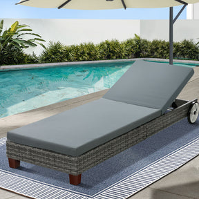 Grey aluminium reclining sun lounger beside a pool