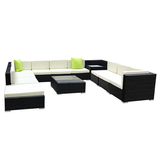 Twelve piece brown rattan outdoor sofa set with cushions and glass tables