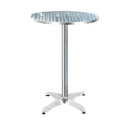 Bowen round silver aluminium outdoor bar table in an outdoor setting