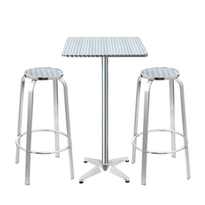 Black Rock silver aluminium 3 piece outdoor bar set with two stools and adjustable table on a patio