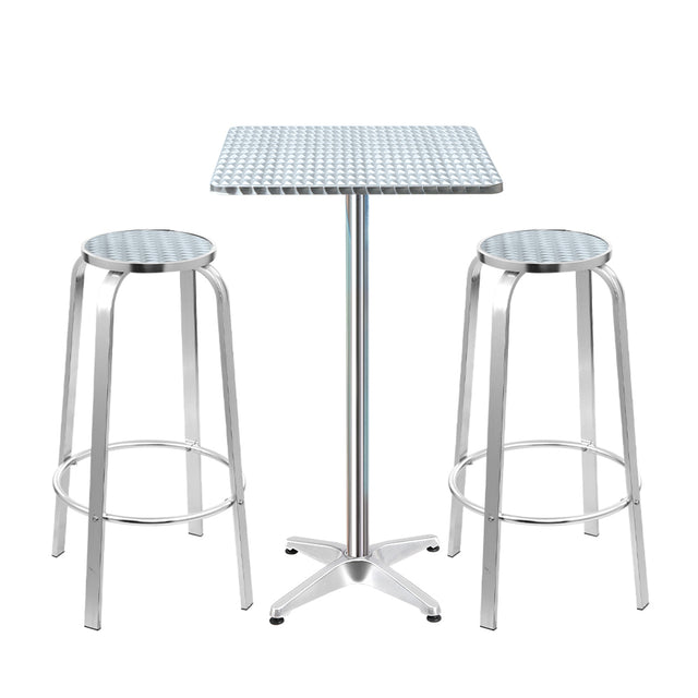 Black Rock silver aluminium 3 piece outdoor bar set with two stools and adjustable table on a patio