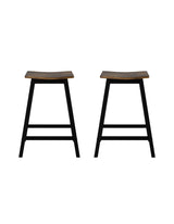 Edithvale rustic brown wooden bar stool with saddle seat in an industrial kitchen