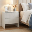 Lennox Head beige two drawer bedside table with push to open drawers in a modern bedroom