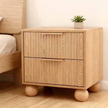 Borba pine and rattan bedside table with two drawers in a coastal bedroom