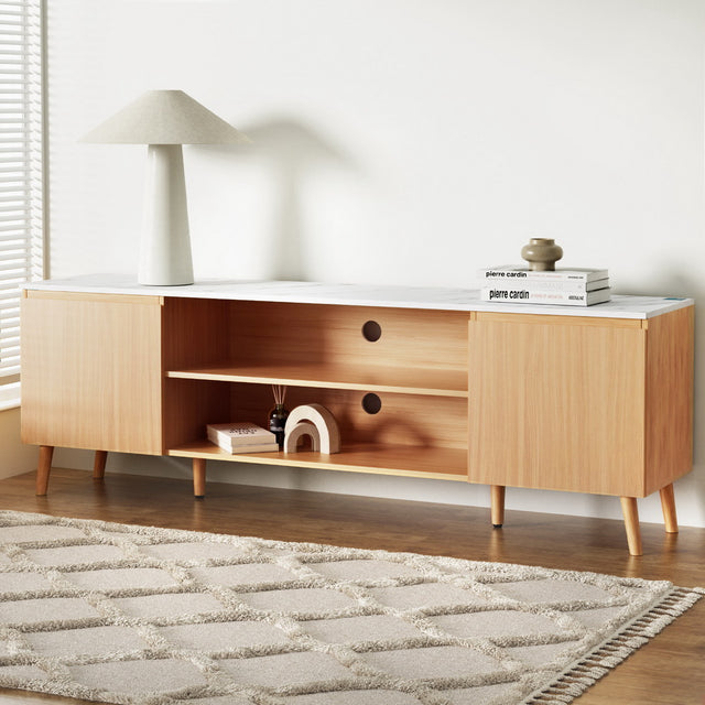 Swansea 180cm white entertainment unit with marble effect top and pine wood legs in a modern living room