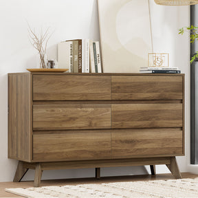 Saskia six drawer chest of drawers in walnut in a modern bedroom