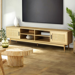 Evandale 180cm natural rattan entertainment unit with cabinets and open shelves in a coastal living room