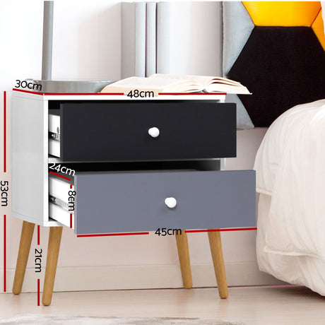 Dunoon black and white two tone two drawer bedside table with splayed legs in a bedroom