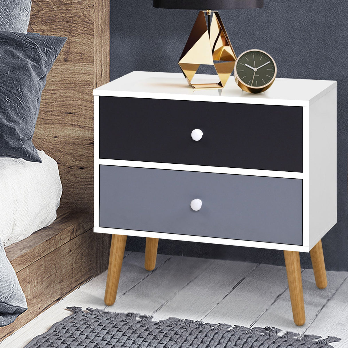 Dunoon black and white two tone two drawer bedside table with splayed legs in a bedroom