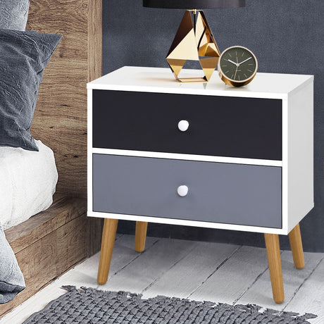 Dunoon black and white two tone two drawer bedside table with splayed legs in a bedroom
