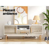 Perth 120cm white and wood Scandinavian TV cabinet with splayed legs in a modern living room