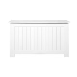 White toy box storing blankets and cushions