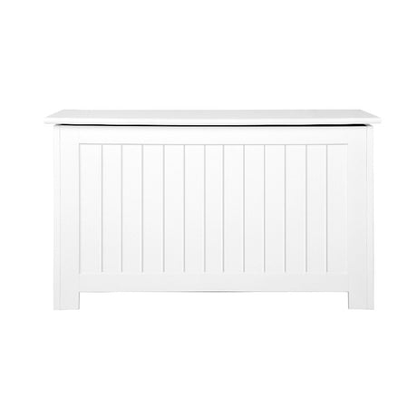 White toy box storing blankets and cushions
