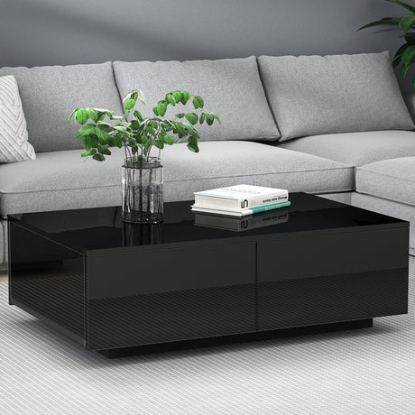 Yarra Junction black high gloss coffee table in a modern living room