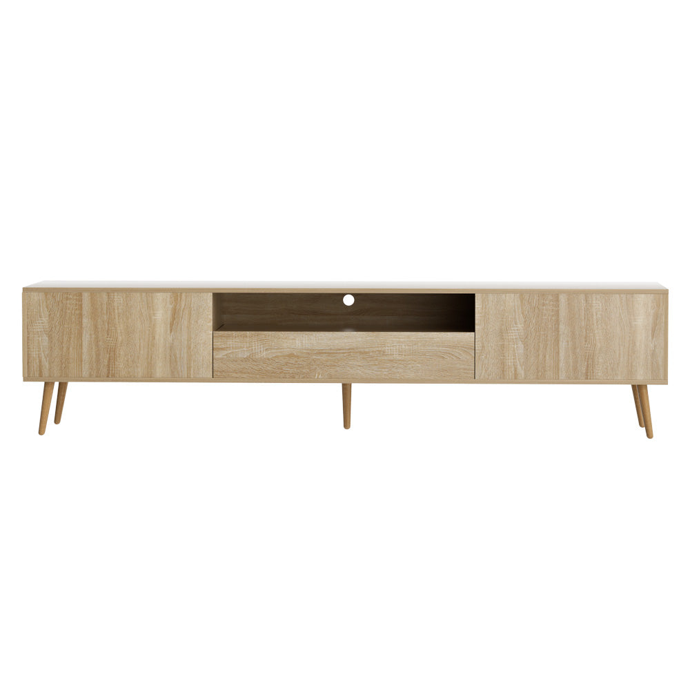 Woodbridge pine 200cm lowline entertainment unit with rubberwood legs in a modern living room