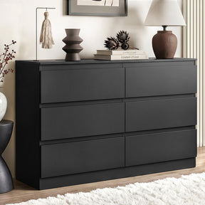 Sienna white and black 6 drawer lowboy with groove handle in a modern bedroom