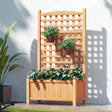 Brown wooden raised garden bed with tall climbing trellis planted with flowers