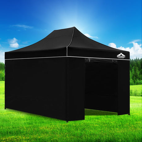 Oxford weave carry bag holding the folded black gazebo and its wall panels