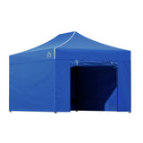 Blue gazebo folded down beside its oxford weave wheeled carry bag