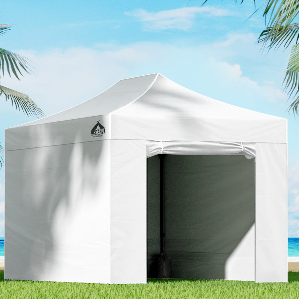 White 3 x 4.5 m pop up gazebo set up outdoors with steel frame and canopy