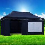 Oxford weave carry bag holding the folded navy gazebo and its wall panels