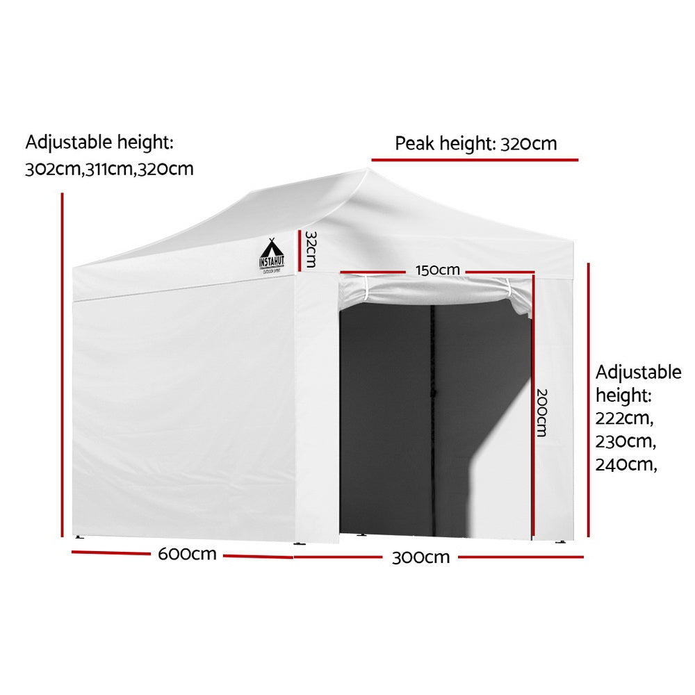 White folding marquee tent with side walls rolled open showing the space inside