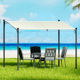 Beige 312 x 260 cm iron art gazebo with decorative steel frame in a garden