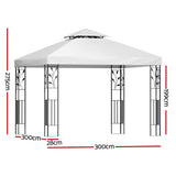 Front view of the white iron art gazebo showing ornate scroll corner detailing