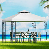 White 3 x 3 m iron art gazebo with decorative steel frame set up outdoors