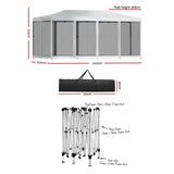 Angled view of the white pop up marquee showing the peaked canopy and steel leg frame
