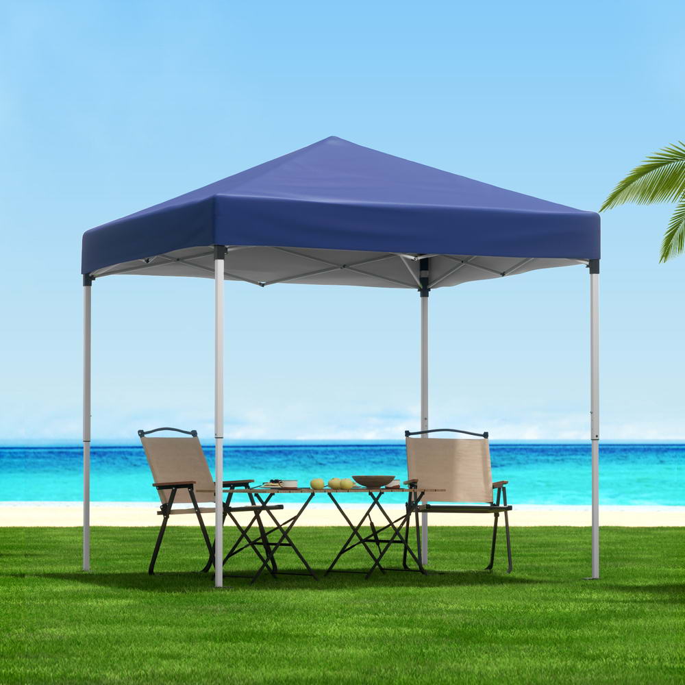 Blue 2 x 2 m pop up gazebo set up on grass in a backyard
