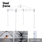Grey gazebo folded into its carry bag with ropes and pegs