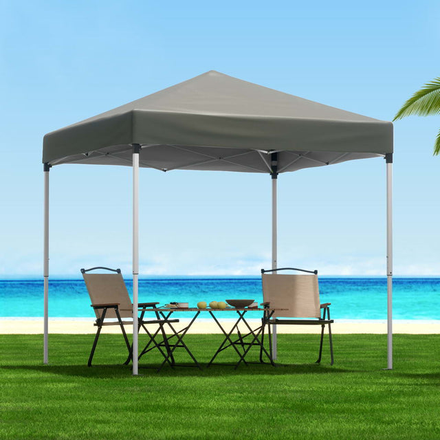 Grey 2 x 2 m pop up gazebo with four white base pods on the legs