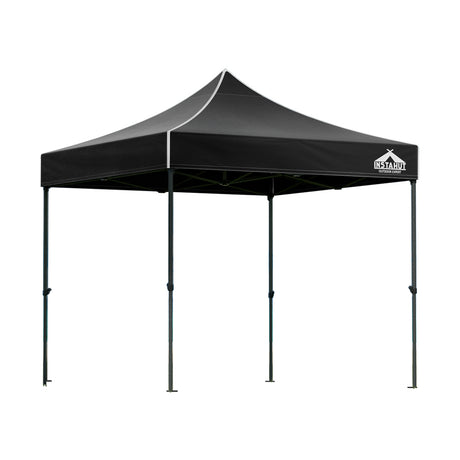 Black pop up gazebo shown providing shade at an outdoor event