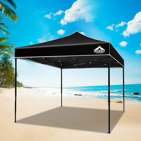 Black pop up gazebo partly folded during set up