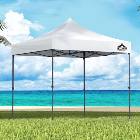 White 3 x 3 m pop up gazebo set up outdoors with open sides